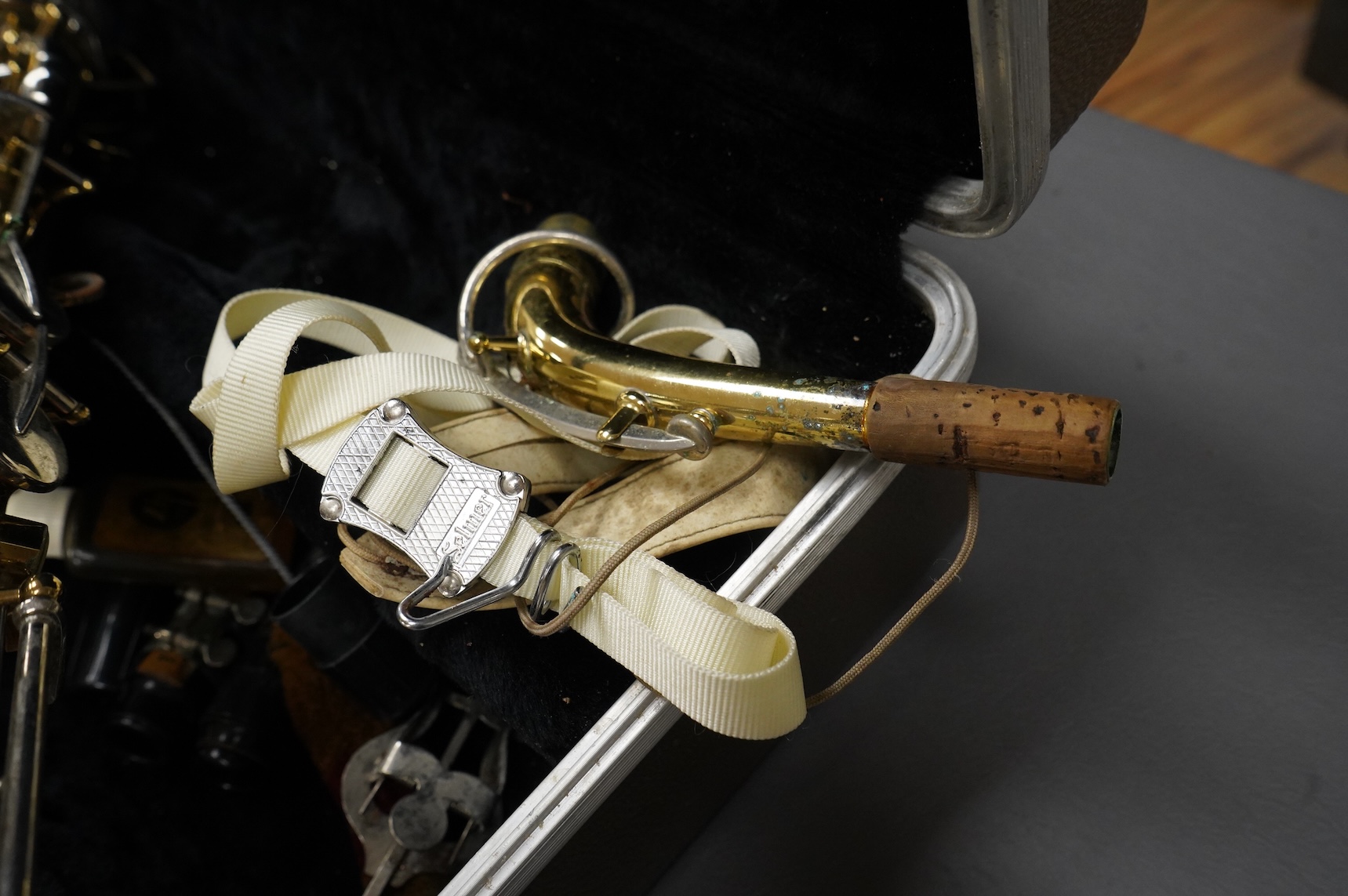 A cased Buesohner Aristocrat alto saxophone